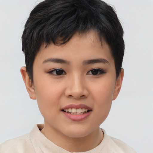 Joyful asian child female with short  brown hair and brown eyes
