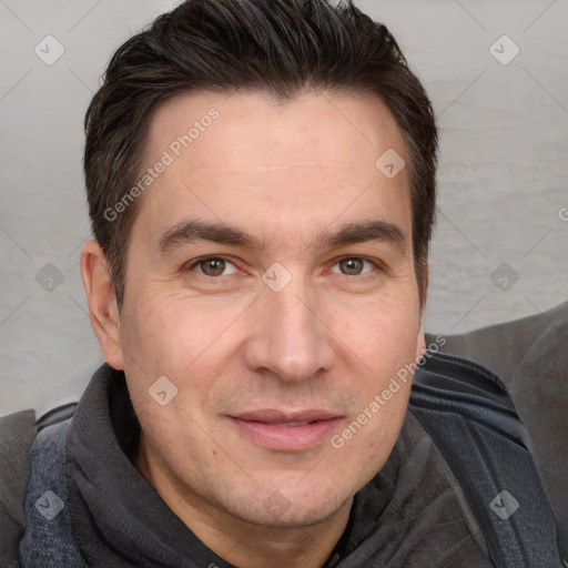 Joyful white adult male with short  brown hair and brown eyes