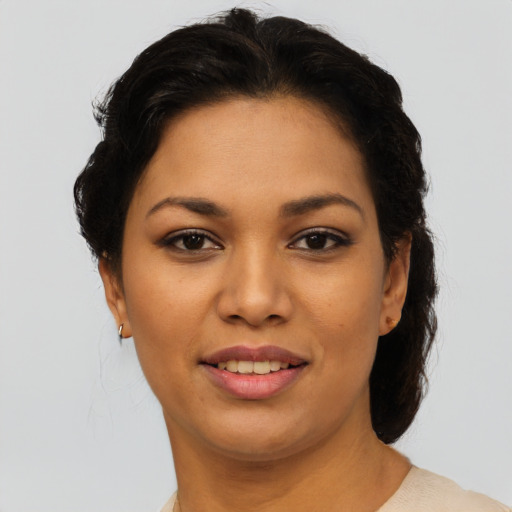 Joyful latino young-adult female with short  brown hair and brown eyes