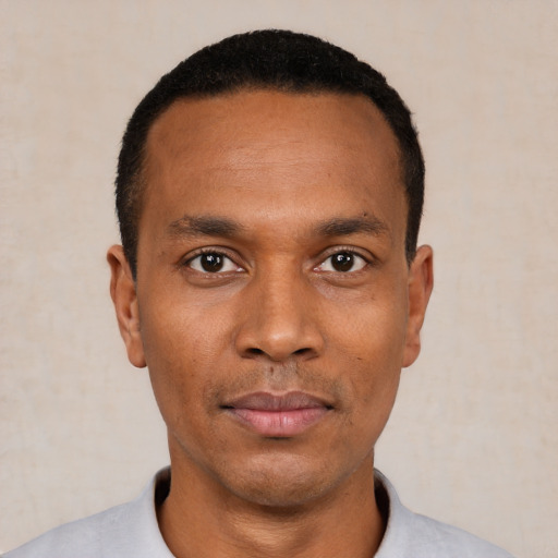 Neutral black young-adult male with short  black hair and brown eyes