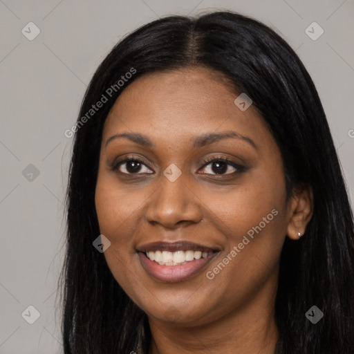 Joyful black young-adult female with long  black hair and brown eyes