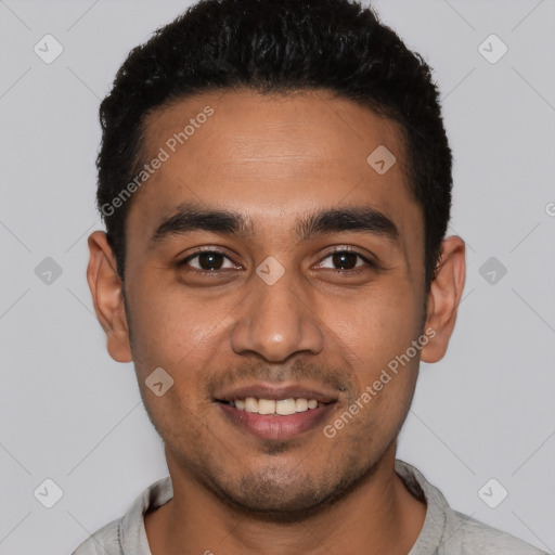 Joyful latino young-adult male with short  black hair and brown eyes