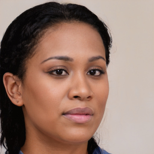 Neutral black young-adult female with long  brown hair and brown eyes