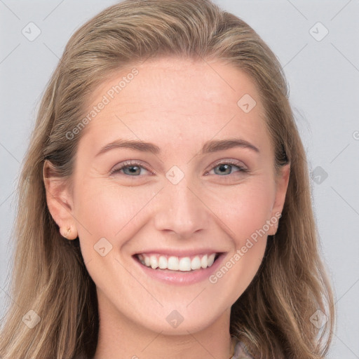 Joyful white young-adult female with long  brown hair and blue eyes