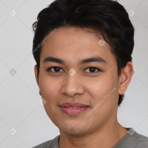 Joyful latino young-adult male with short  black hair and brown eyes