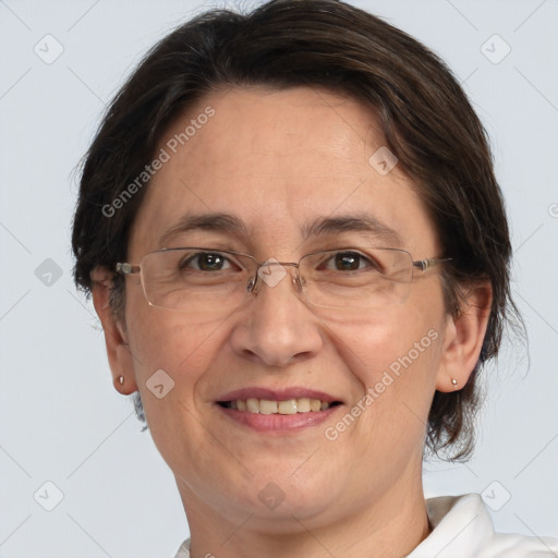 Joyful white adult female with short  brown hair and grey eyes