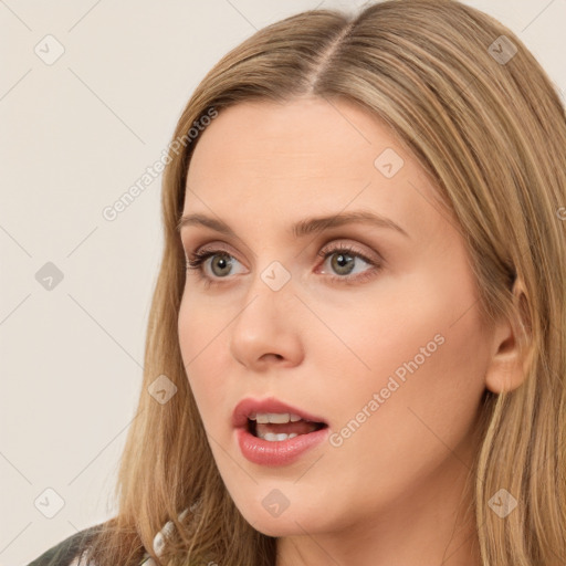 Neutral white young-adult female with long  brown hair and brown eyes