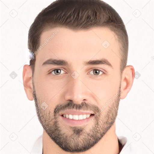 Joyful white young-adult male with short  brown hair and brown eyes