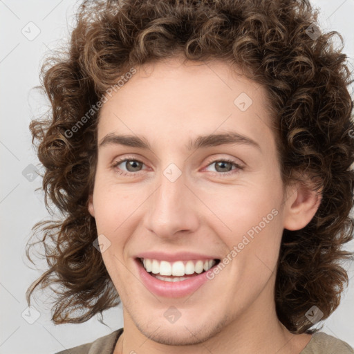 Joyful white young-adult female with medium  brown hair and green eyes