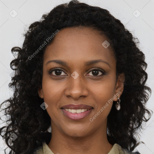 Joyful black young-adult female with long  brown hair and brown eyes