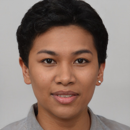 Joyful asian young-adult female with short  brown hair and brown eyes