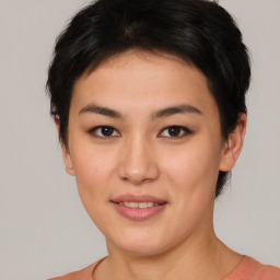 Joyful asian young-adult female with short  brown hair and brown eyes