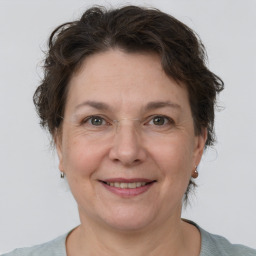 Joyful white adult female with short  brown hair and brown eyes