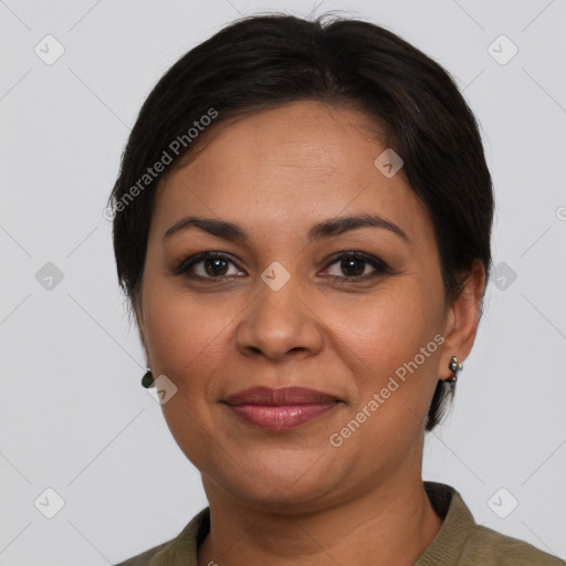 Joyful latino adult female with short  brown hair and brown eyes
