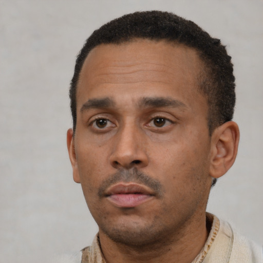 Neutral black young-adult male with short  black hair and brown eyes
