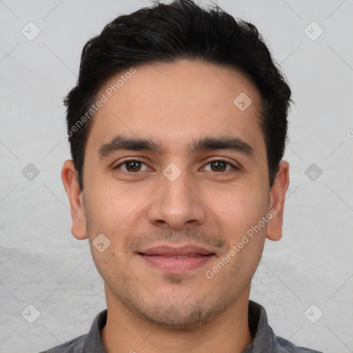 Joyful white young-adult male with short  black hair and brown eyes