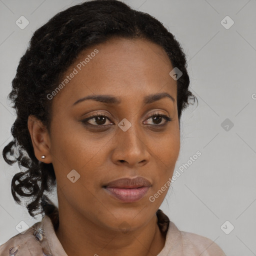 Joyful black young-adult female with long  brown hair and brown eyes