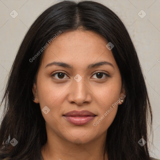 Joyful latino young-adult female with long  brown hair and brown eyes