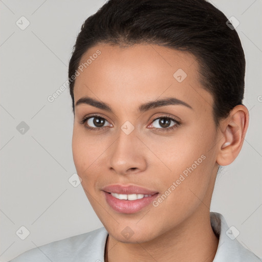 Joyful white young-adult female with short  brown hair and brown eyes