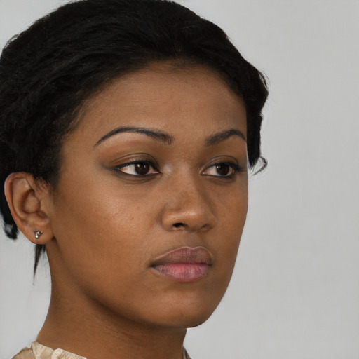 Neutral black young-adult female with short  brown hair and brown eyes