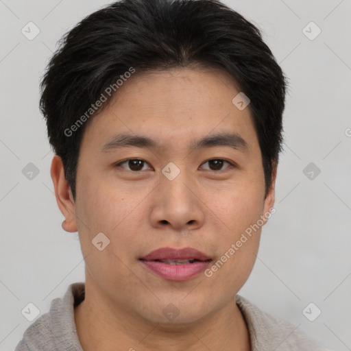 Joyful asian young-adult male with short  brown hair and brown eyes