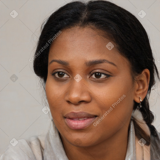 Joyful black young-adult female with medium  brown hair and brown eyes