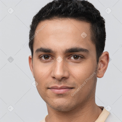 Neutral latino young-adult male with short  black hair and brown eyes