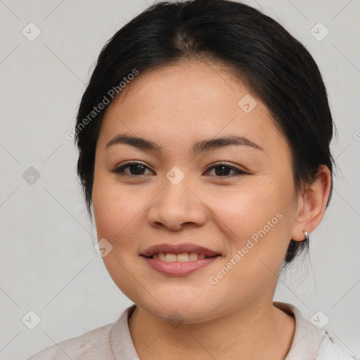 Joyful latino young-adult female with medium  brown hair and brown eyes