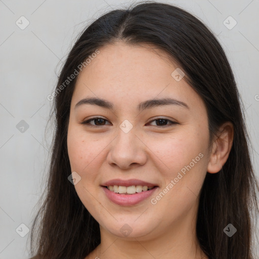 Joyful white young-adult female with long  brown hair and brown eyes