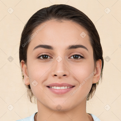 Joyful white young-adult female with medium  brown hair and brown eyes