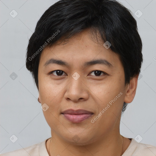 Joyful asian young-adult male with short  brown hair and brown eyes