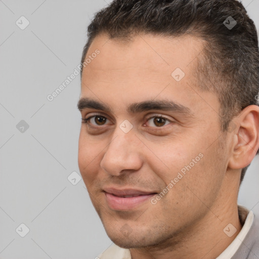 Joyful white young-adult male with short  brown hair and brown eyes