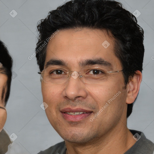 Joyful white adult male with short  black hair and brown eyes