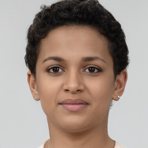 Joyful latino young-adult female with short  brown hair and brown eyes