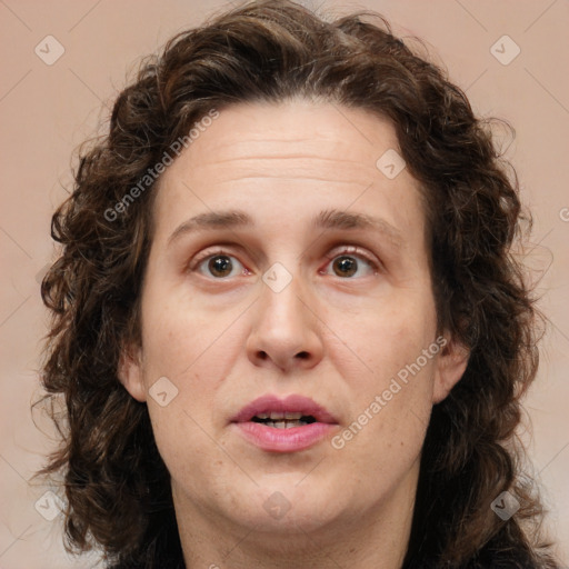 Joyful white adult female with medium  brown hair and green eyes