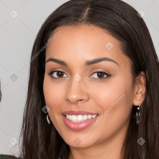 Joyful latino young-adult female with long  brown hair and brown eyes