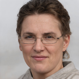 Joyful white adult female with short  brown hair and grey eyes