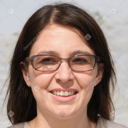 Joyful white adult female with medium  brown hair and brown eyes