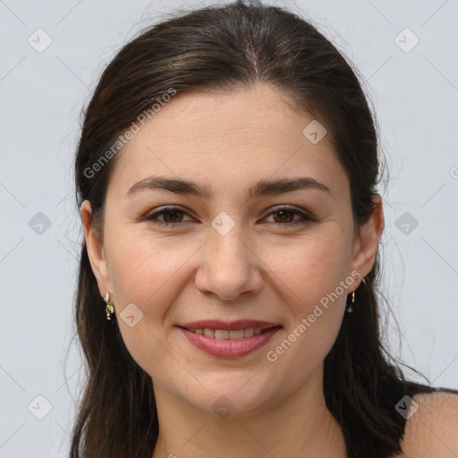 Joyful white young-adult female with long  brown hair and brown eyes