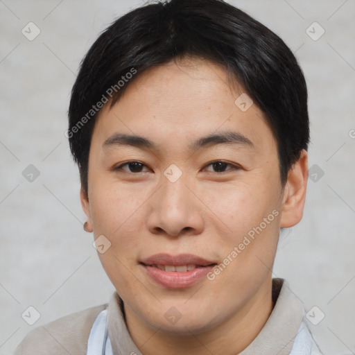 Joyful asian young-adult male with short  brown hair and brown eyes