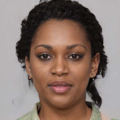 Neutral black young-adult female with medium  black hair and brown eyes