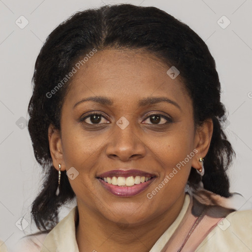 Joyful latino adult female with medium  brown hair and brown eyes