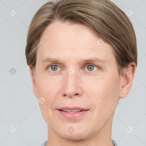 Joyful white adult male with short  brown hair and grey eyes