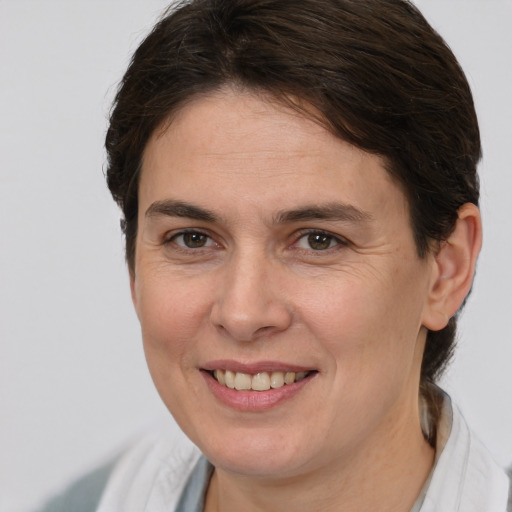 Joyful white young-adult female with medium  brown hair and brown eyes