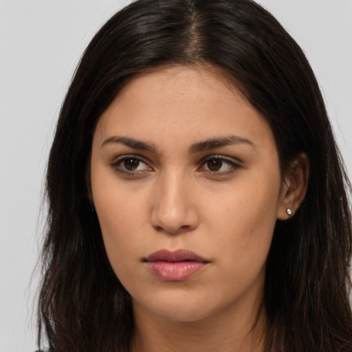Neutral latino young-adult female with long  brown hair and brown eyes
