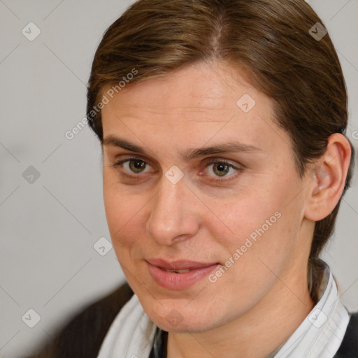 Joyful white adult female with short  brown hair and brown eyes