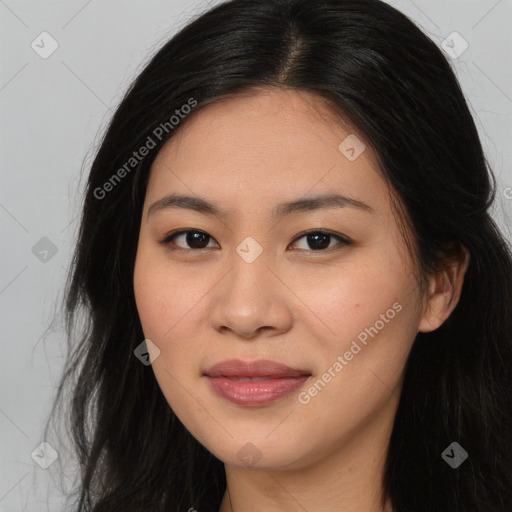 Joyful asian young-adult female with long  brown hair and brown eyes