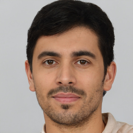 Neutral latino young-adult male with short  black hair and brown eyes