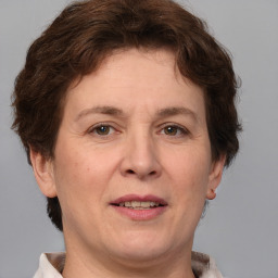 Joyful white adult female with short  brown hair and brown eyes