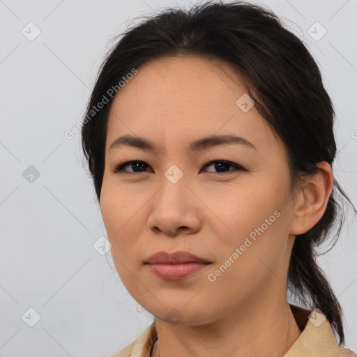 Joyful asian young-adult female with medium  brown hair and brown eyes